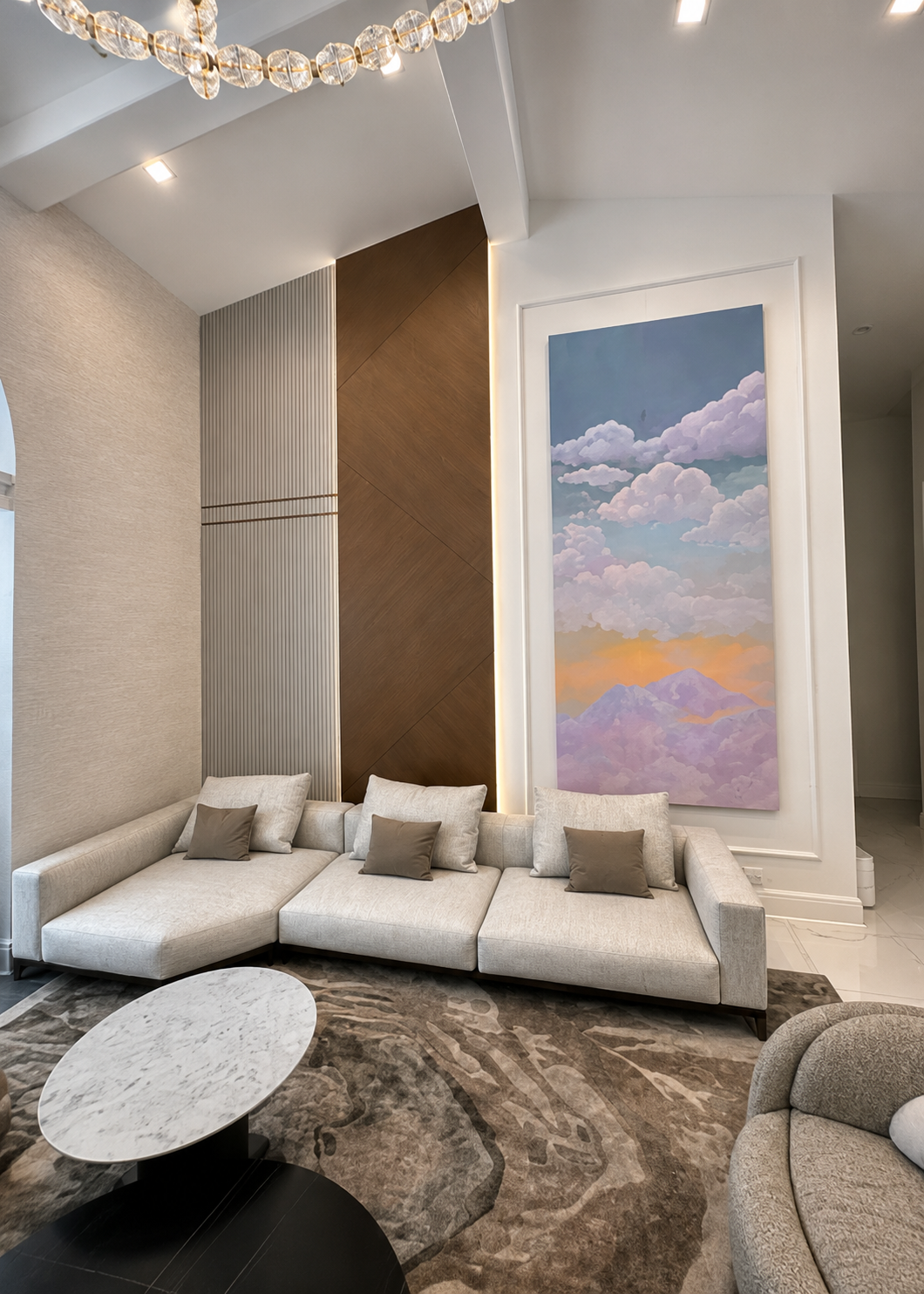 Formal sitting area with cloud triptych and crystal chandelier