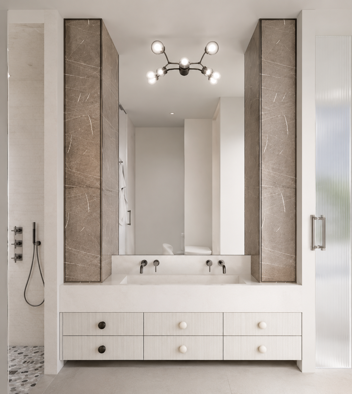Primary bathroom vanity with marble panels and fluted drawer fronts